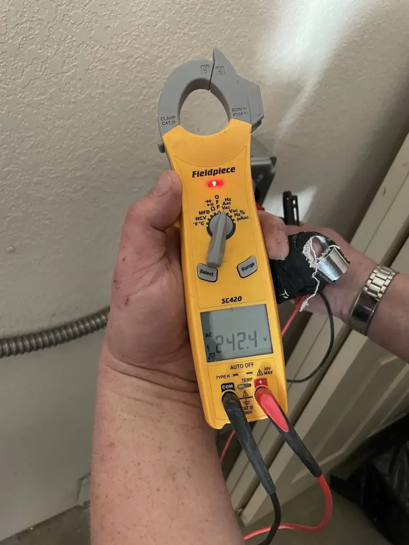 Voltage testing with clamp meter during Generator Installation in Amherst